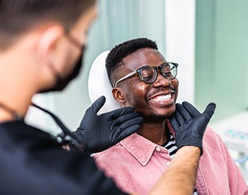 Patient in Morgan Hill smiling in dental chair after oral sedation