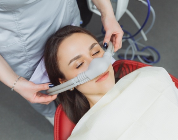Dental patient receiving nitrous oxide dental sedation treatment