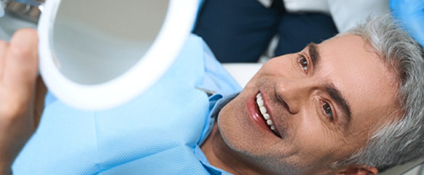 A man happy with his new dental veneers