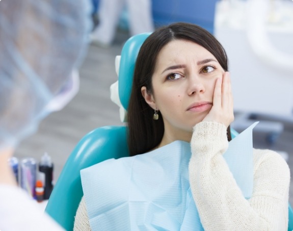 Woman in pain before emergency dentistry