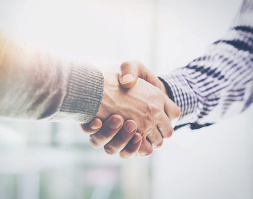 Dentist and patient engaged in friendly conversation