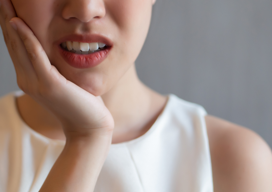 Woman holding jaw
