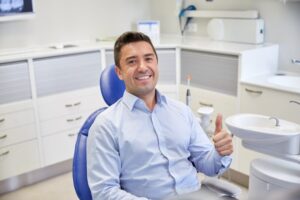 Man smiling while at the dentist