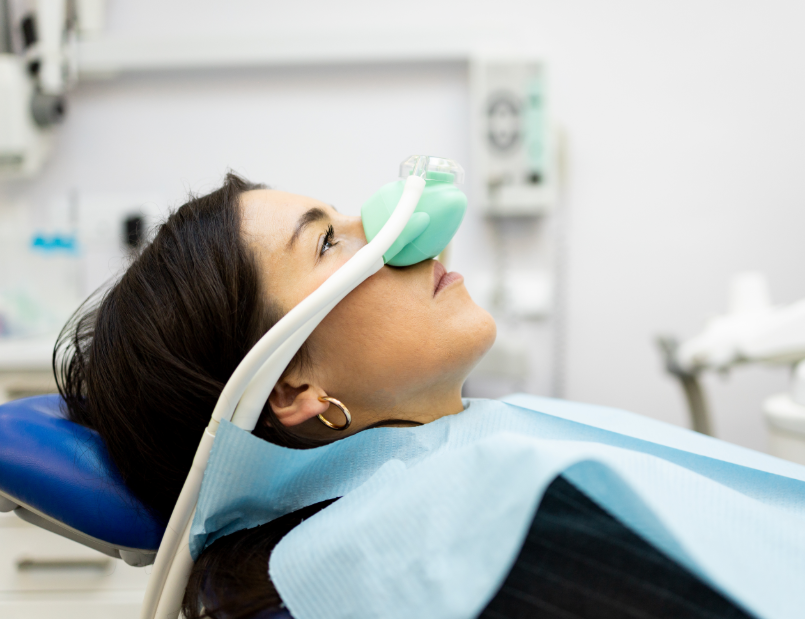 Woman undergoing dental sedation